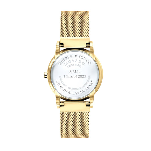 Gold watch shown with back of watch casing engraved