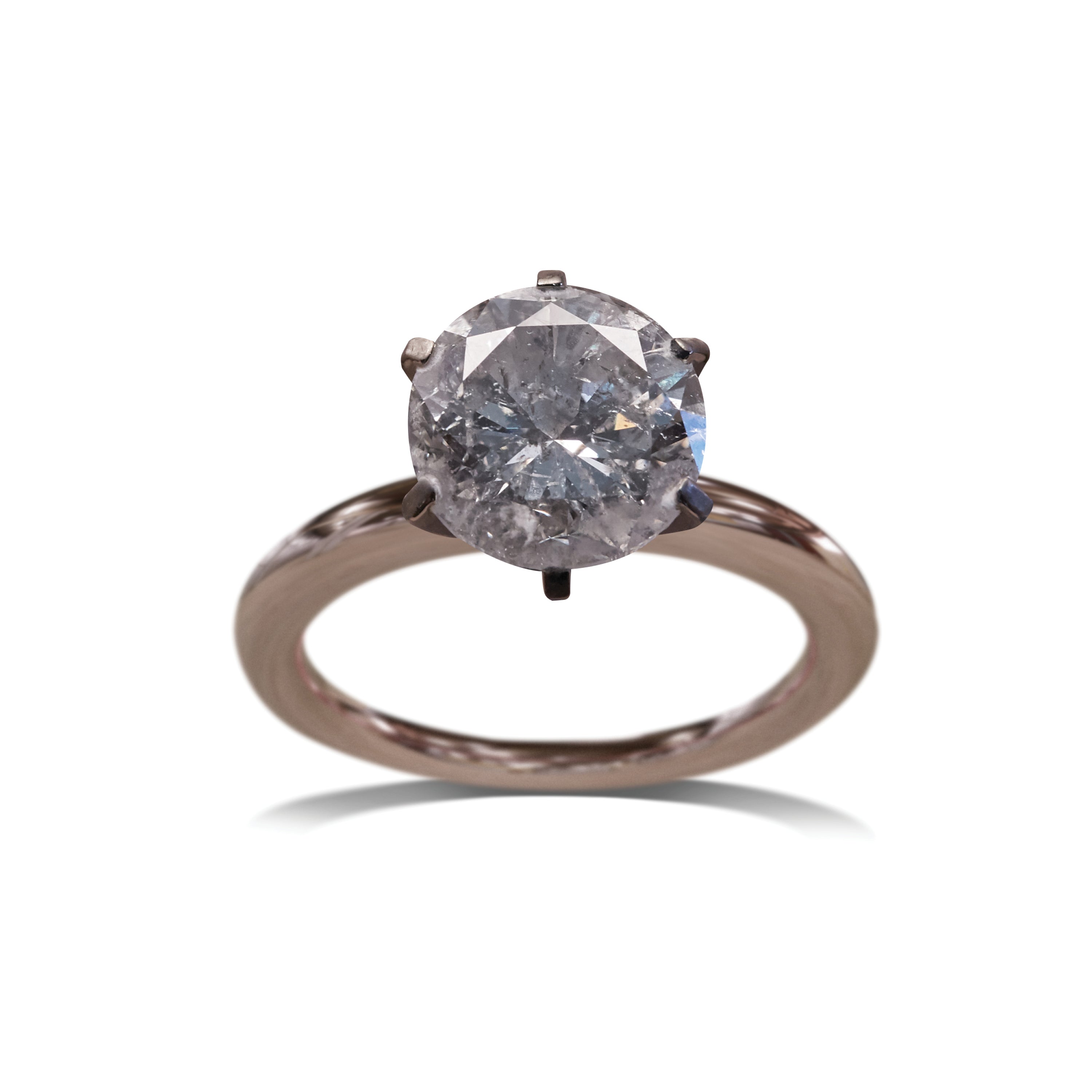 Rose gold engagement ring with prong damage