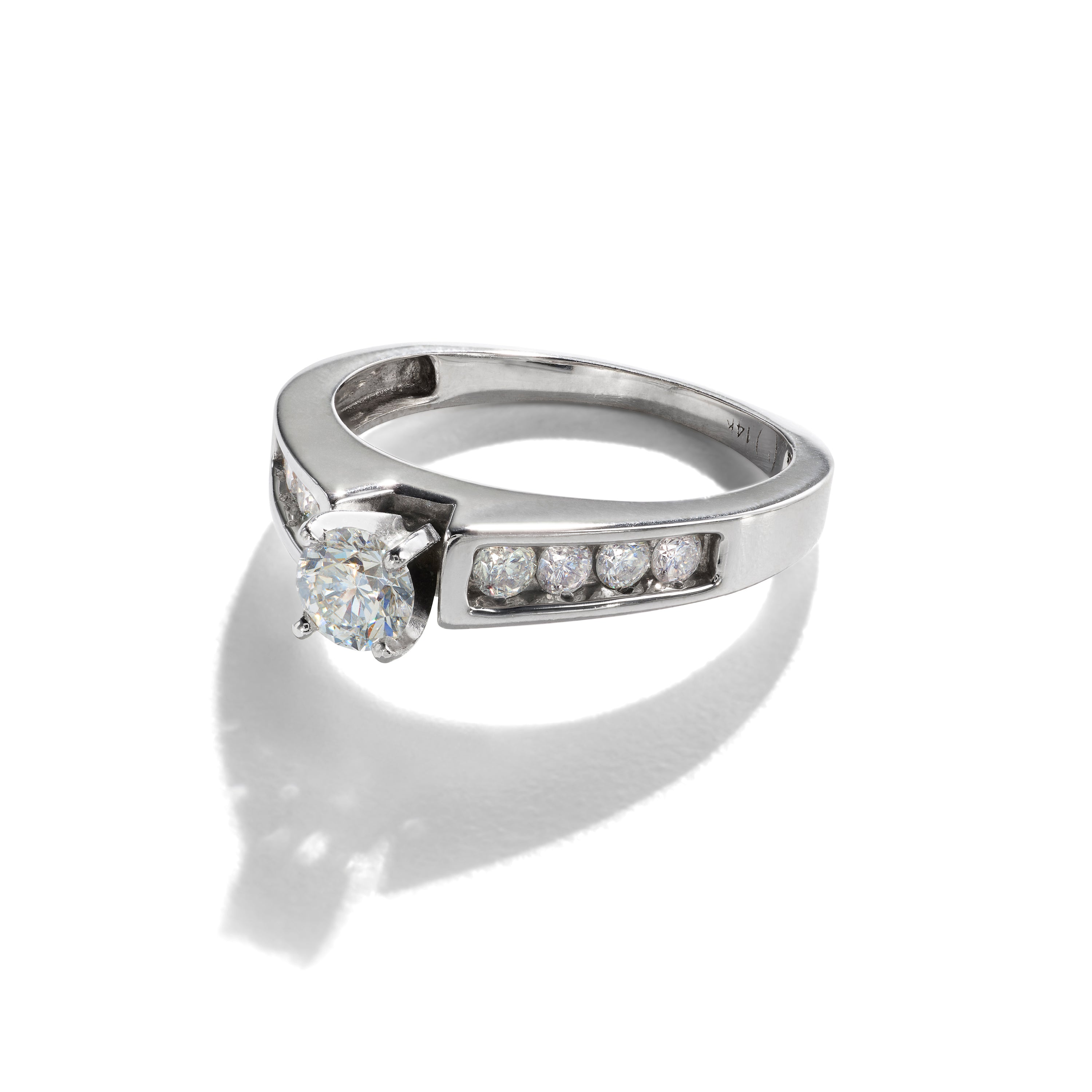 Polished white gold diamond ring