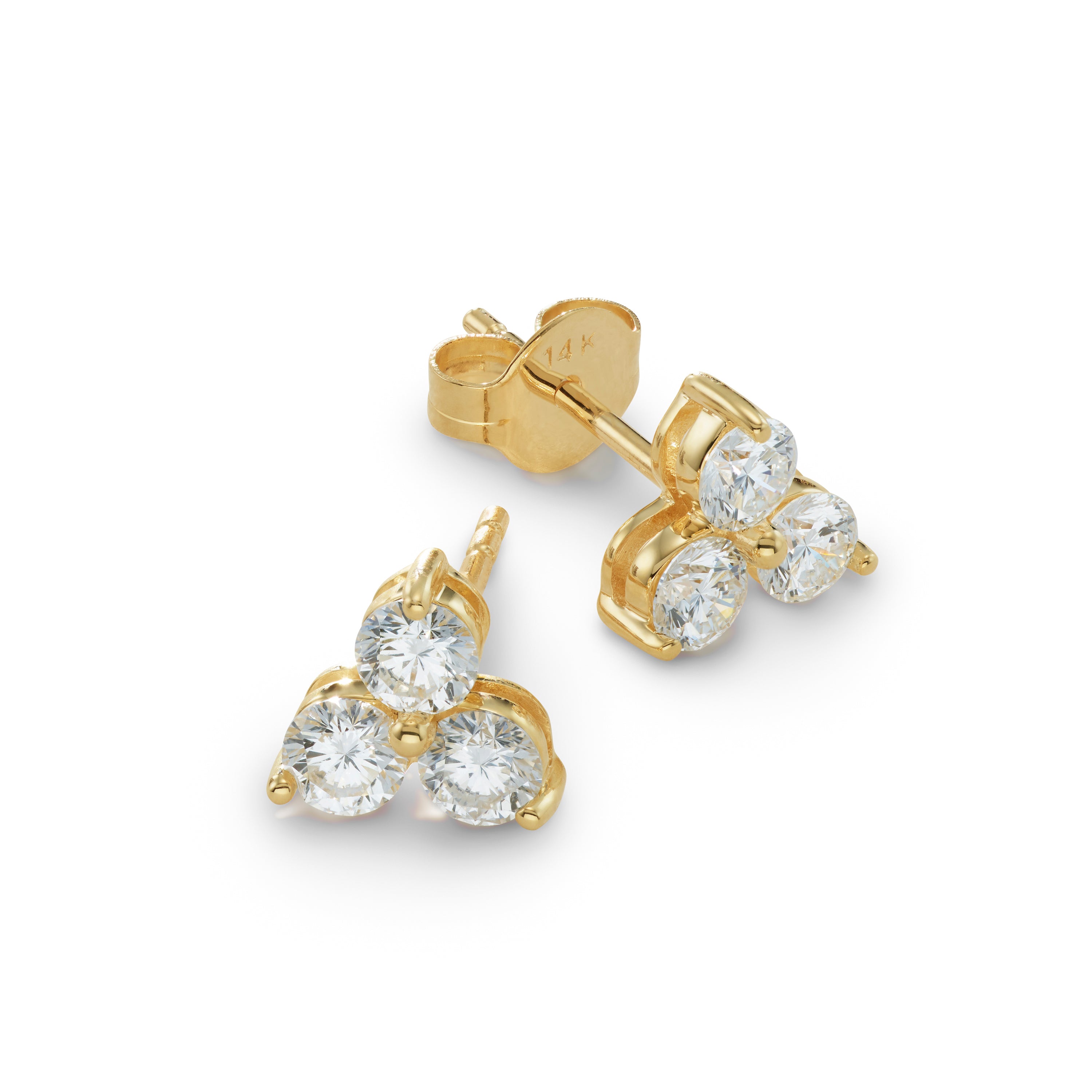 Gold earrings with diamond clusters on a white background