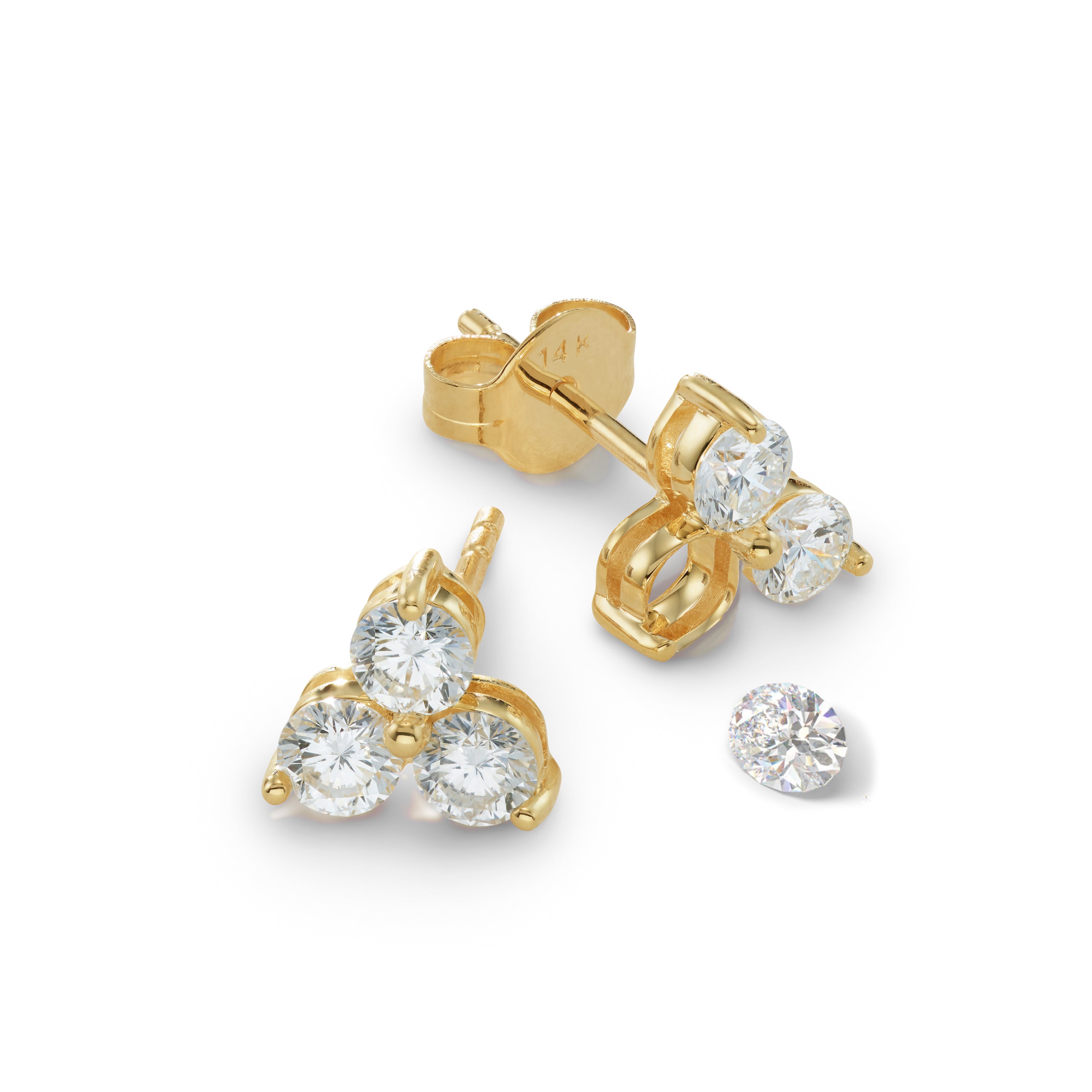 Gold earrings with stone that has fallen out and needs setting 