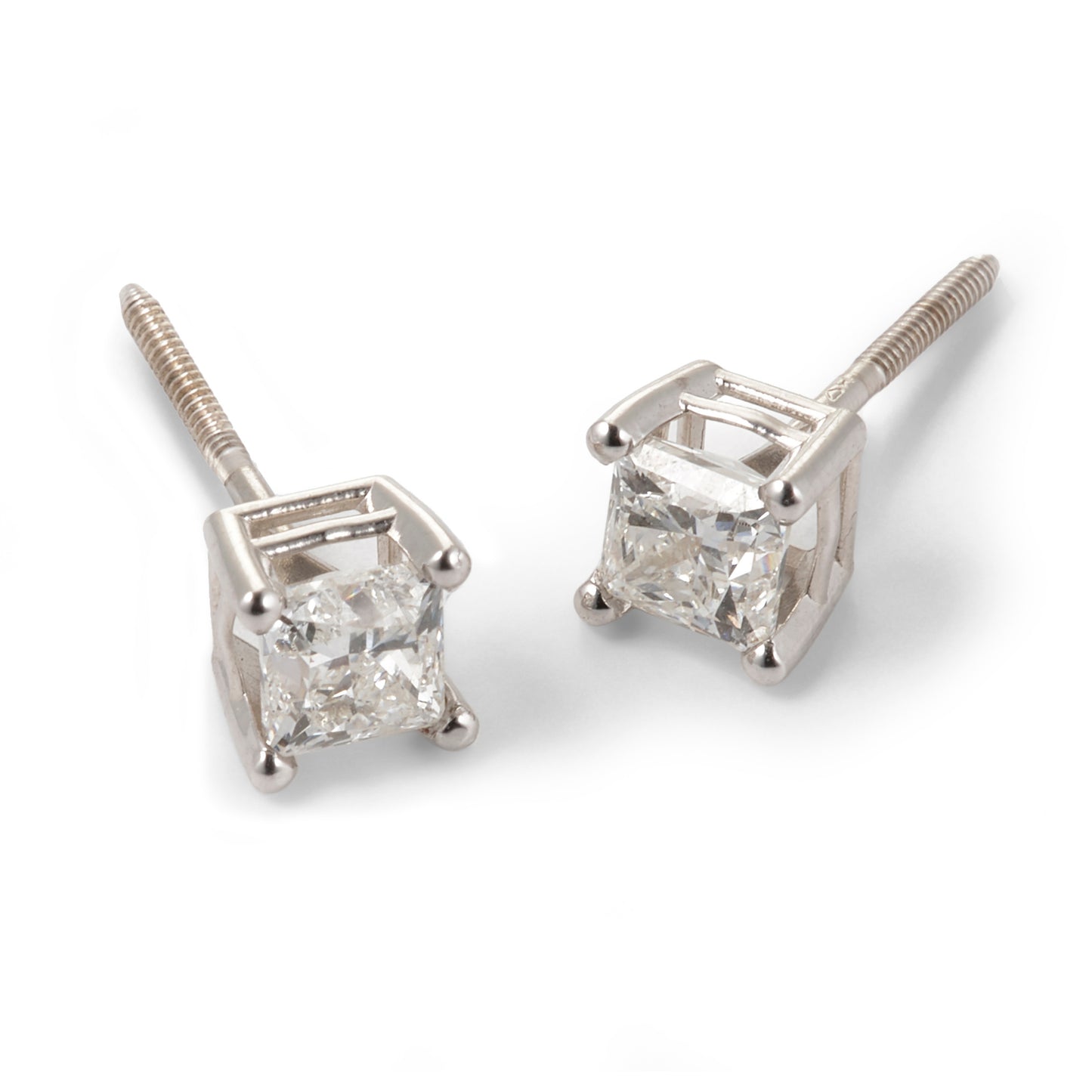 Tarnished of diamond stud earrings on a white background