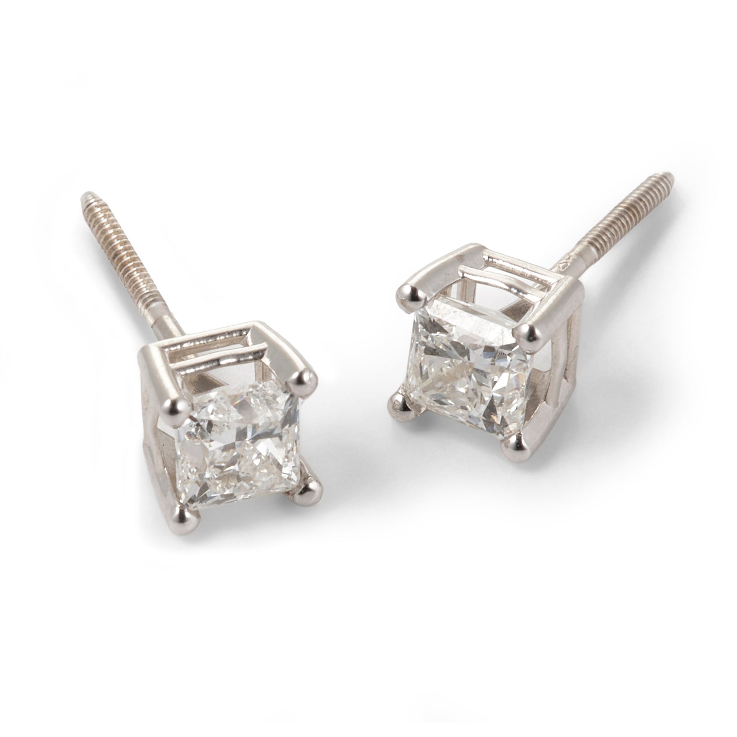 Tarnished of diamond stud earrings on a white background
