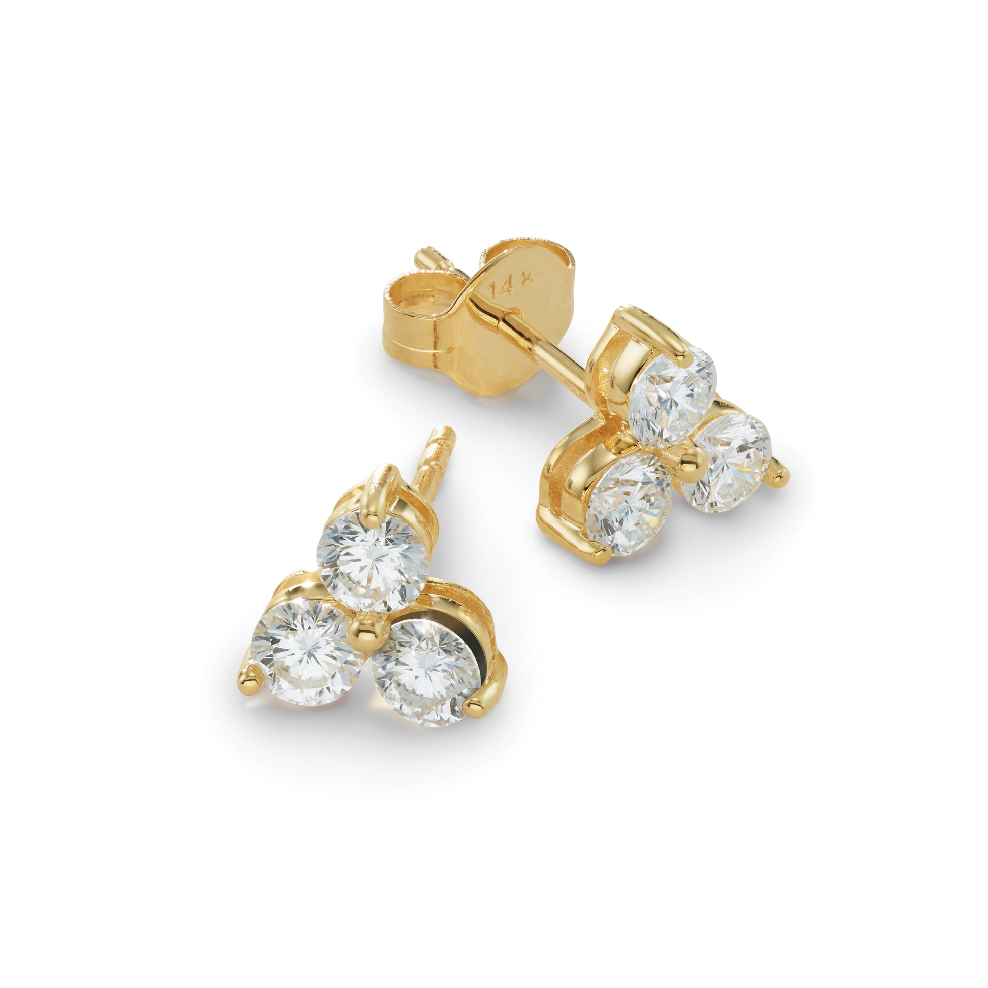 Gold earrings with loose diamond shown on a white background