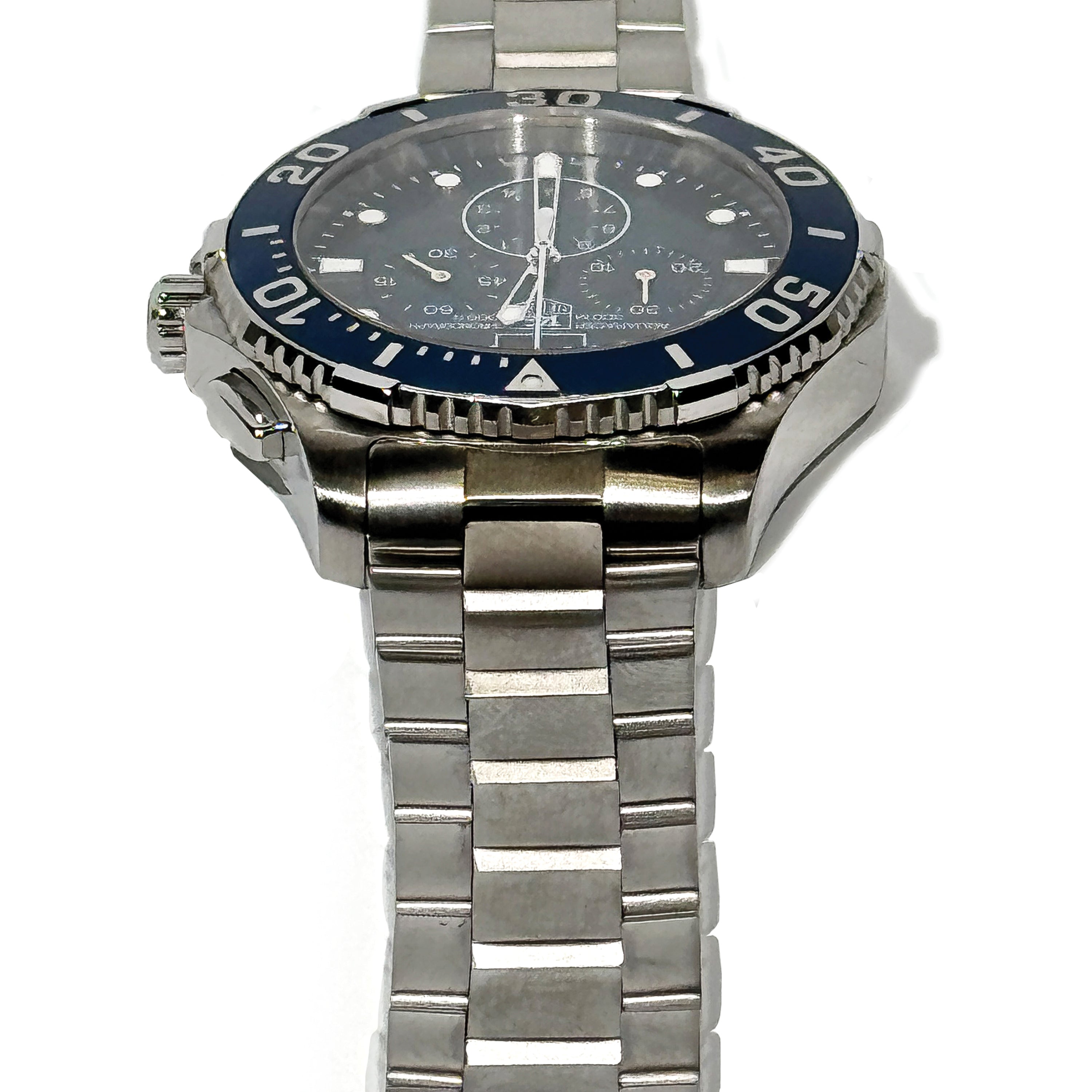 Silver watch with a blue bezel on a white background