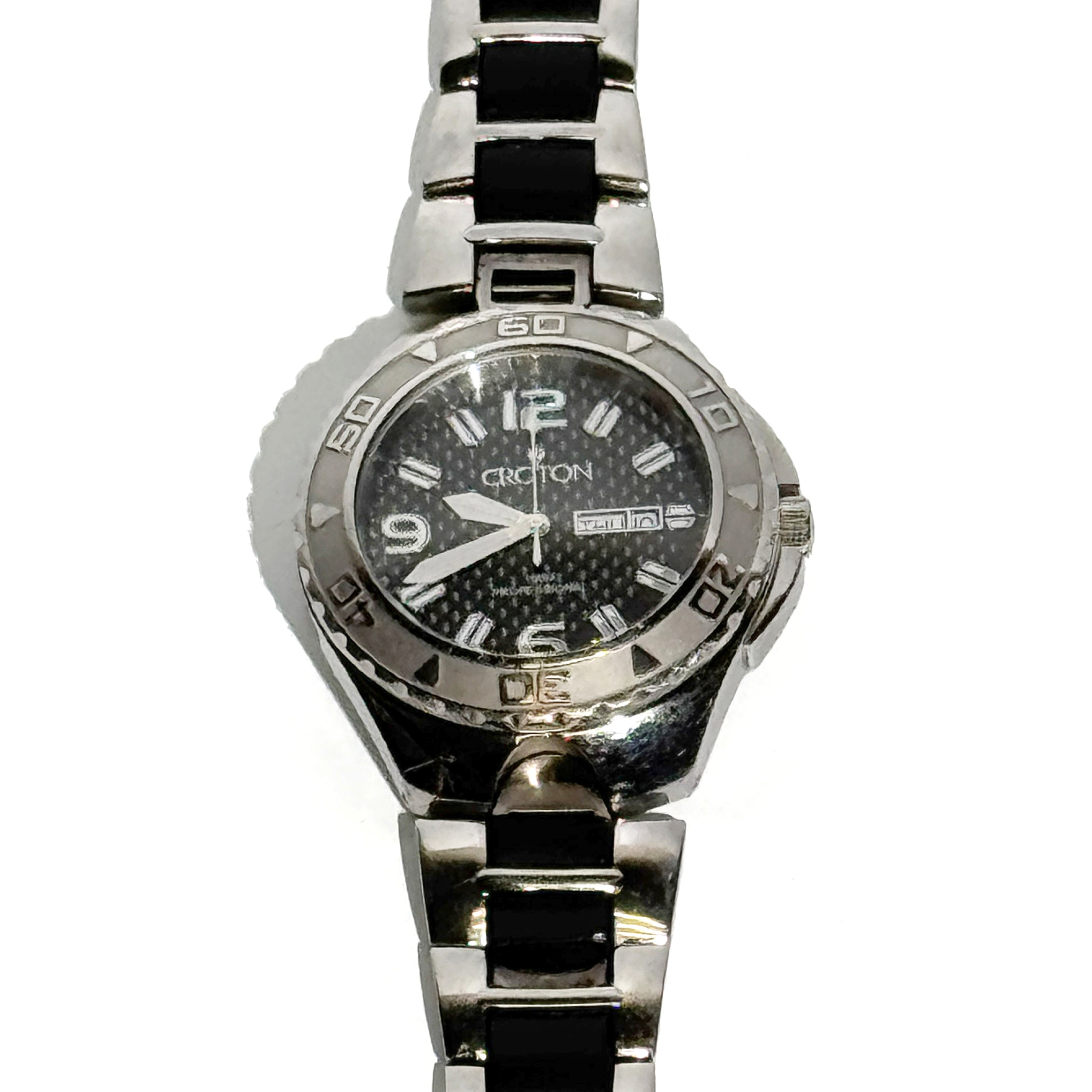 Silver and black watch with a white background