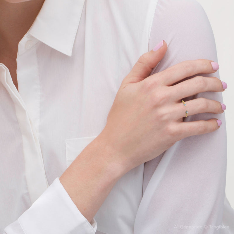 Hand wearing a gold ring on a white background