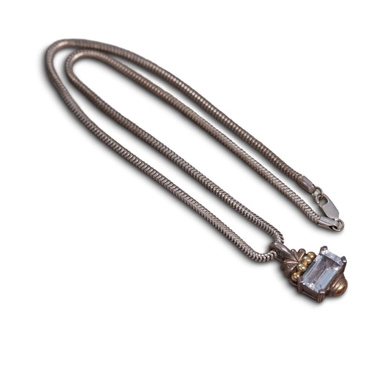 Tarnished necklace with gemstone pendant